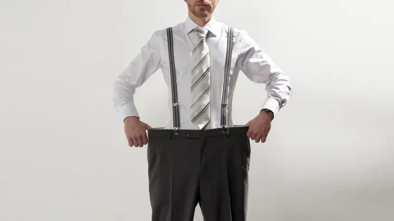 man with too large pants