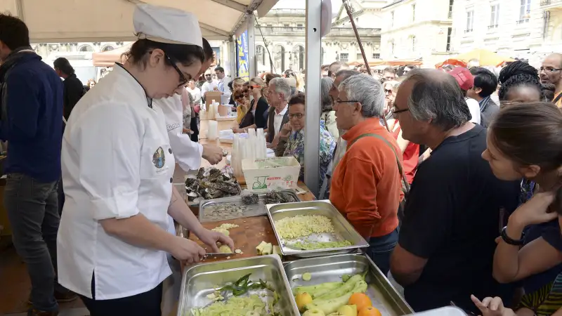 A cook prepares food with unsold products of the food-processing industry during the 'Gaspi'Delice' event in Bordeaux , on June 3, 2015, a few days after French lawmakers voted to stop supermarkets from discarding leftover food, tonnes of which ends up in dustbins every day.