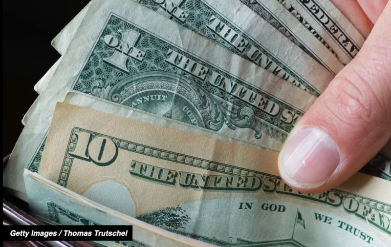 $10 bill in a wallet