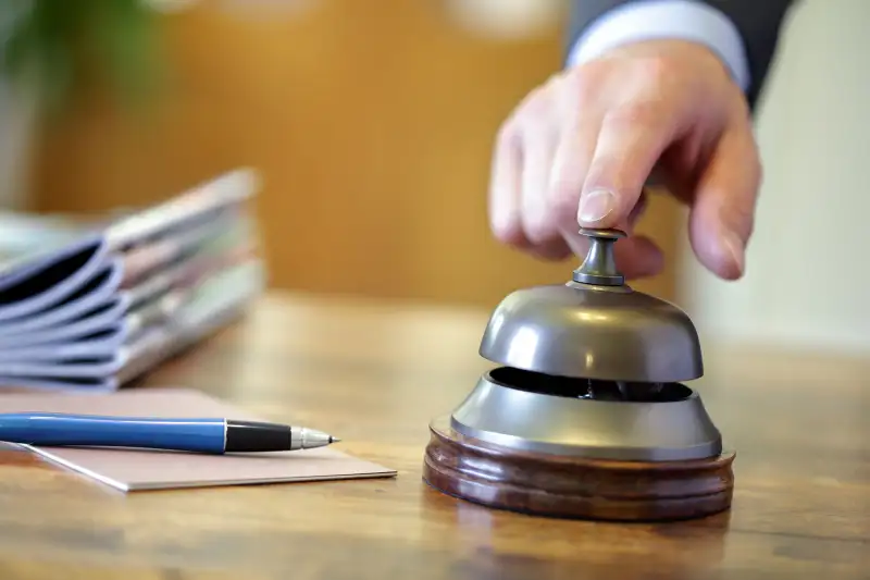 hand ringing reception bell