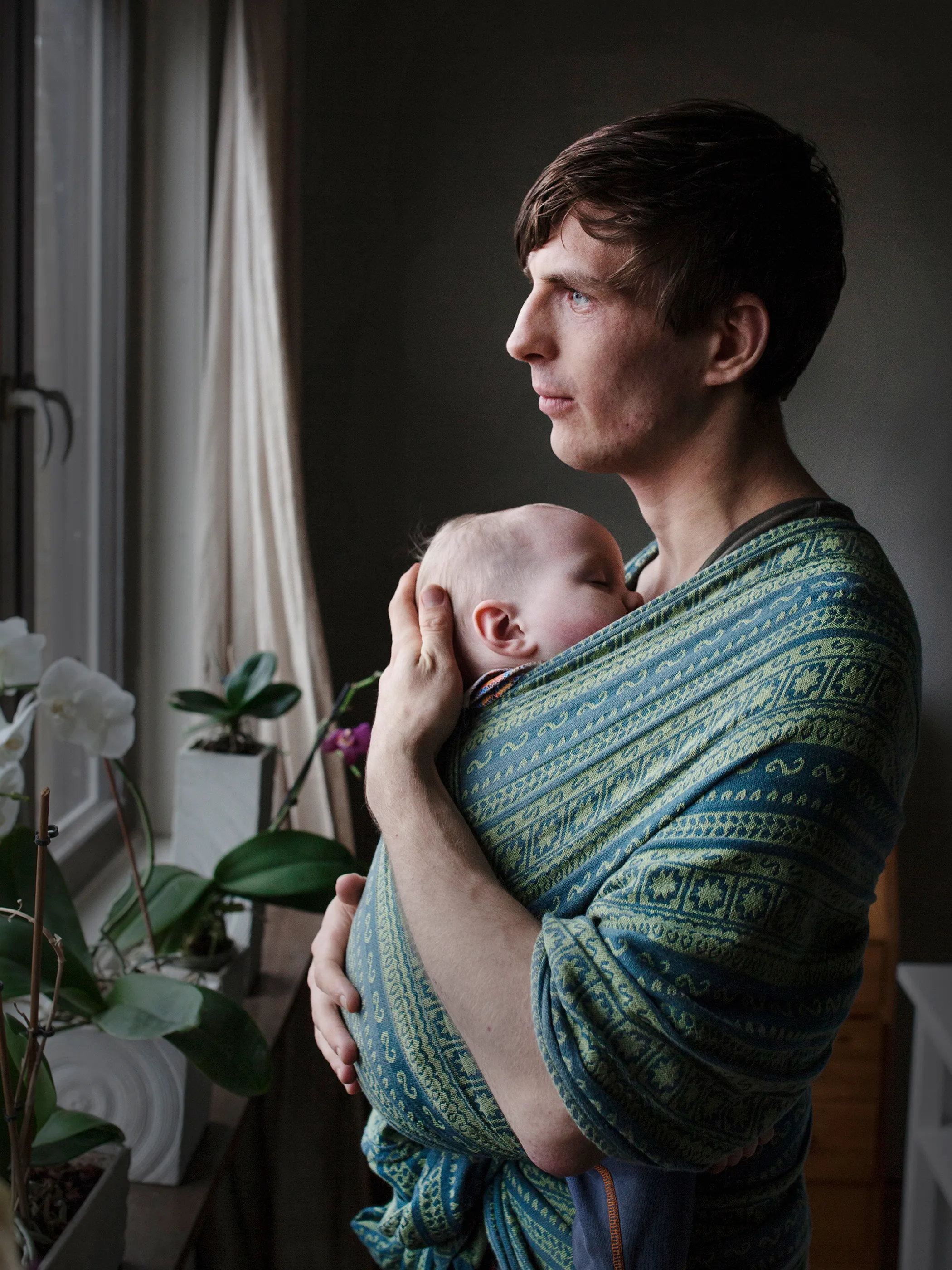 GÖRAN SEVELIN, 27, with daughter Liv. <b>Parental Leave:</b> Ten months. "The baby sling is a substitute for the closeness between mother and child during breastfeeding. My daughter feels very secure in the sling and sleeps in it for two hours in the day, and often at night time. When Liv sleeps, I take the opportunity to get some well-needed rest—a luxury for a parent."