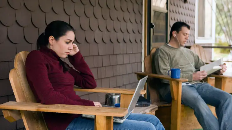 couple sitting in separate chairs