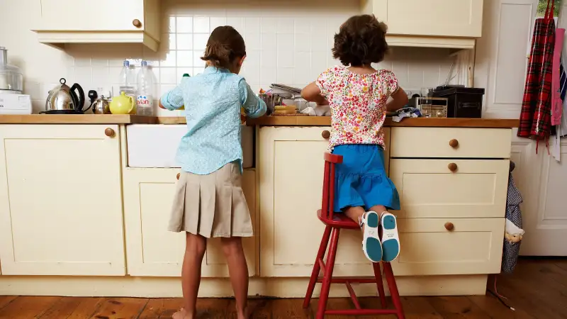 sisters doing dishes