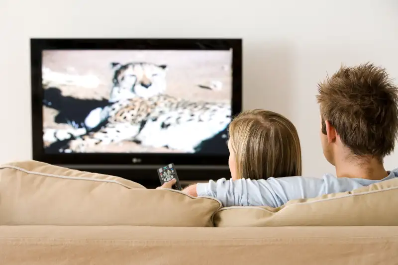 couple on couch watching tv