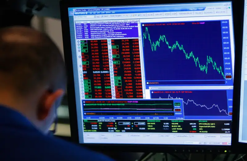 A trader on the floor of the New York Stock Exchange October 7, 2008 in New York City. The Dow fell more than 500 points despite a government debt buyout plan.