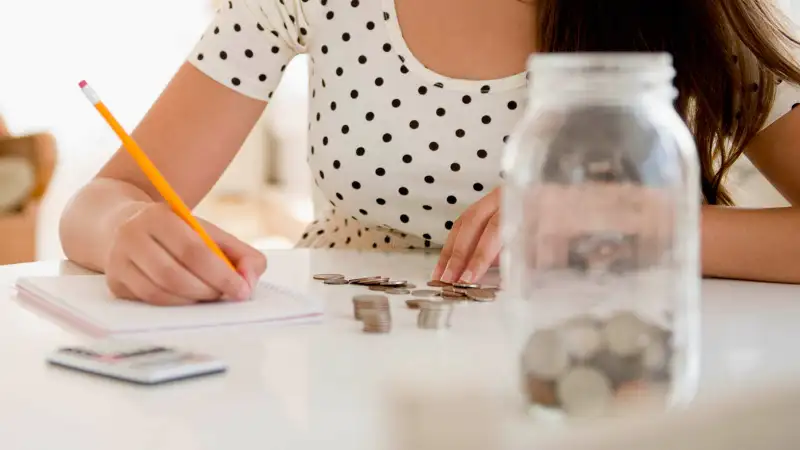 woman counting her savings