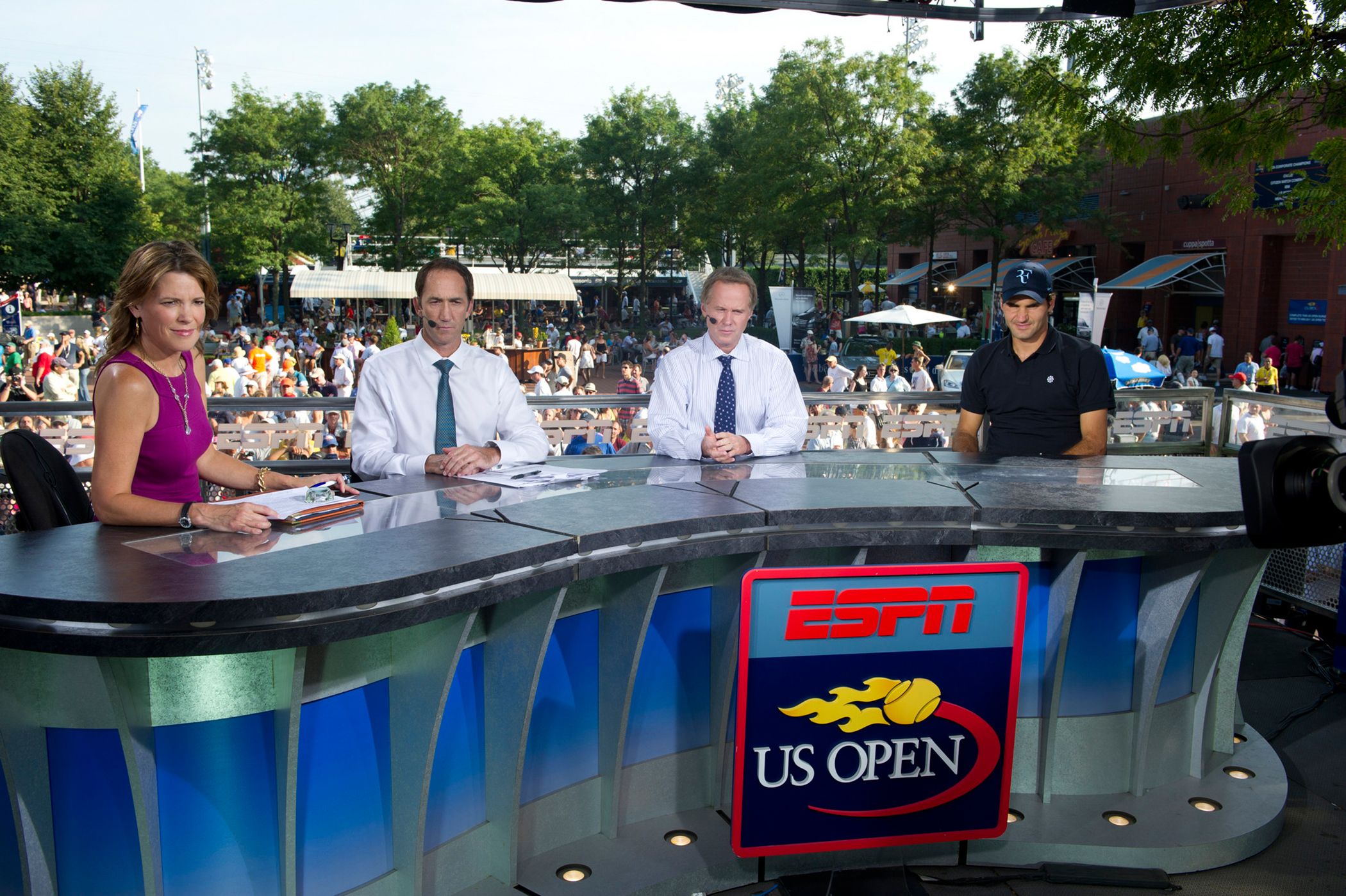 ESPN host Hannah Storm, tennis analysts Darren Cahill and Patrick McEnroe with guest Roger Federer of Switzerland on the on-site set for the US Open Tennis Championships at the USTA Billie Jean King National Tennis Center, 2010.