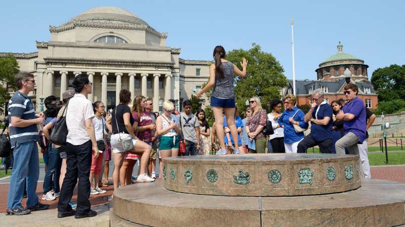 A student leader gives an admissions tour in the center of campus, Columbia University