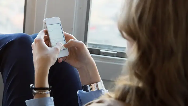 woman texting on mobile phone