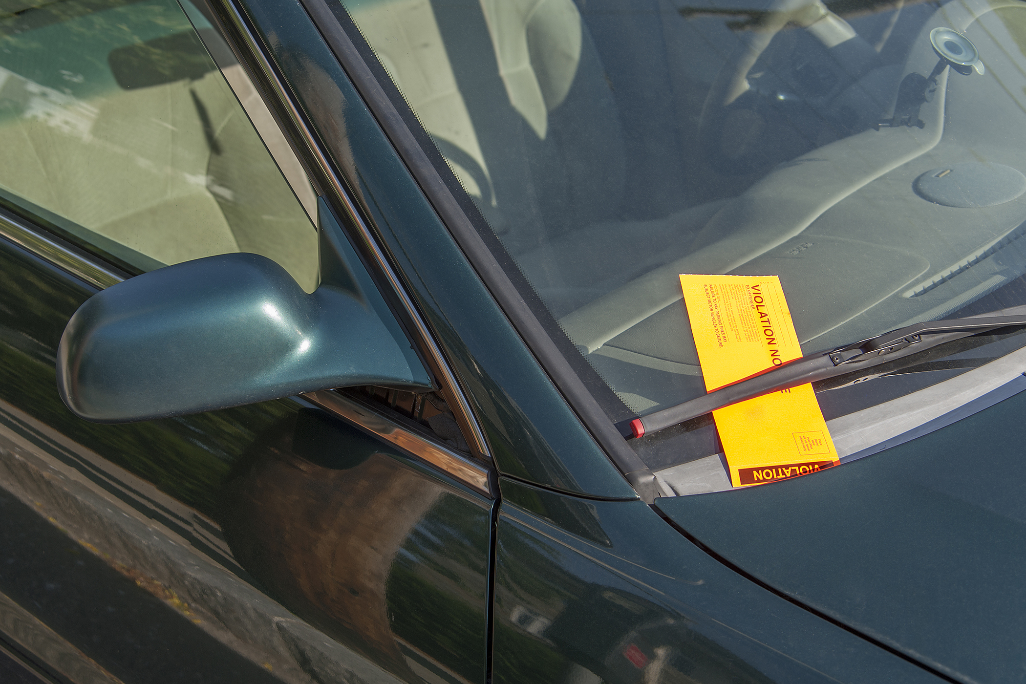 parking ticket under windshield wiper