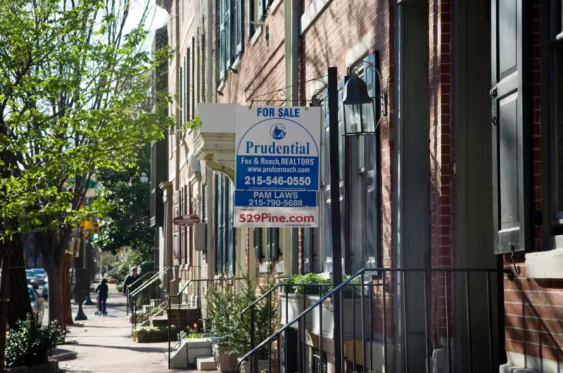 For Sale  sign outside town home in Society Hill neighborhood, Philadelphia, Pennsylvania