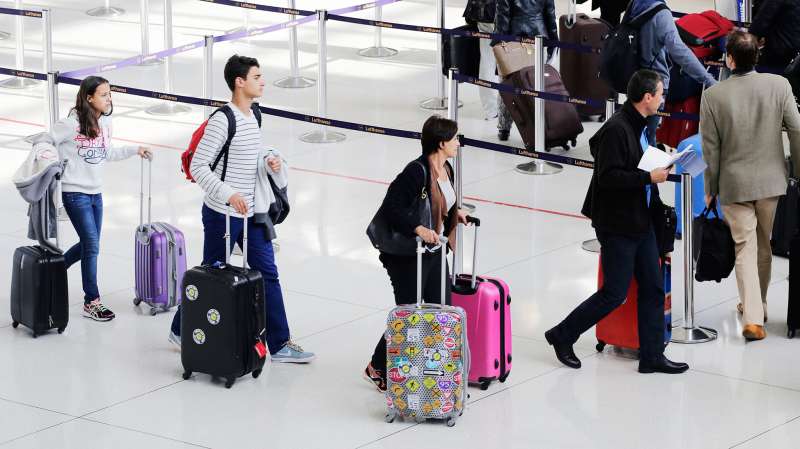 Passengers line up to check in for a flight at John F. Kennedy International Airport, Thursday, Oct. 30, 2014 in New York.