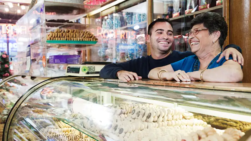 mother and son in deli patisserie store