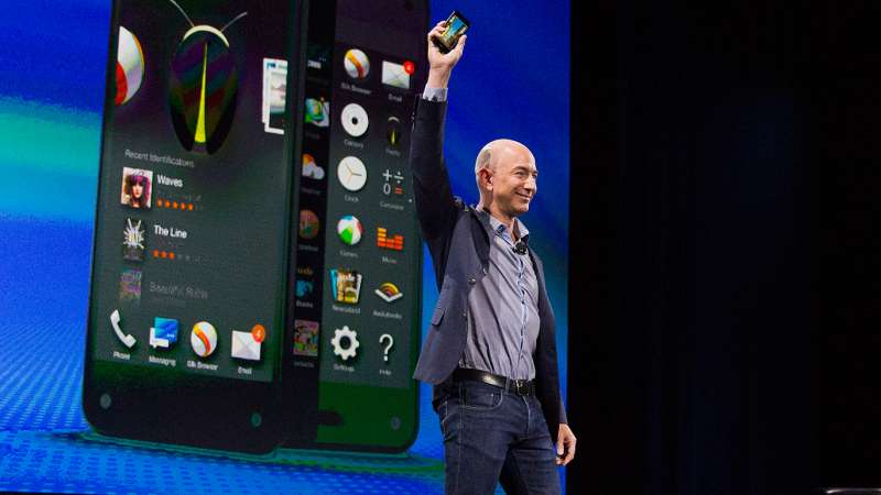 Jeff Bezos, chief executive officer of Amazon.com Inc., unveils the Fire Phone during an event at Fremont Studios in Seattle, Washington, U.S., on Wednesday, June 18, 2014.