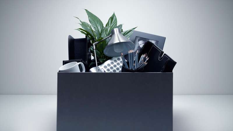 box of office supplies on desk