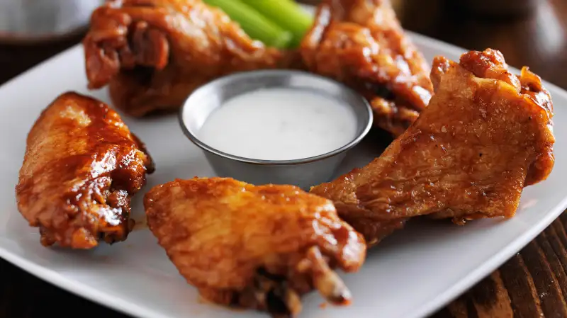 Chicken wings on plate in restaurant