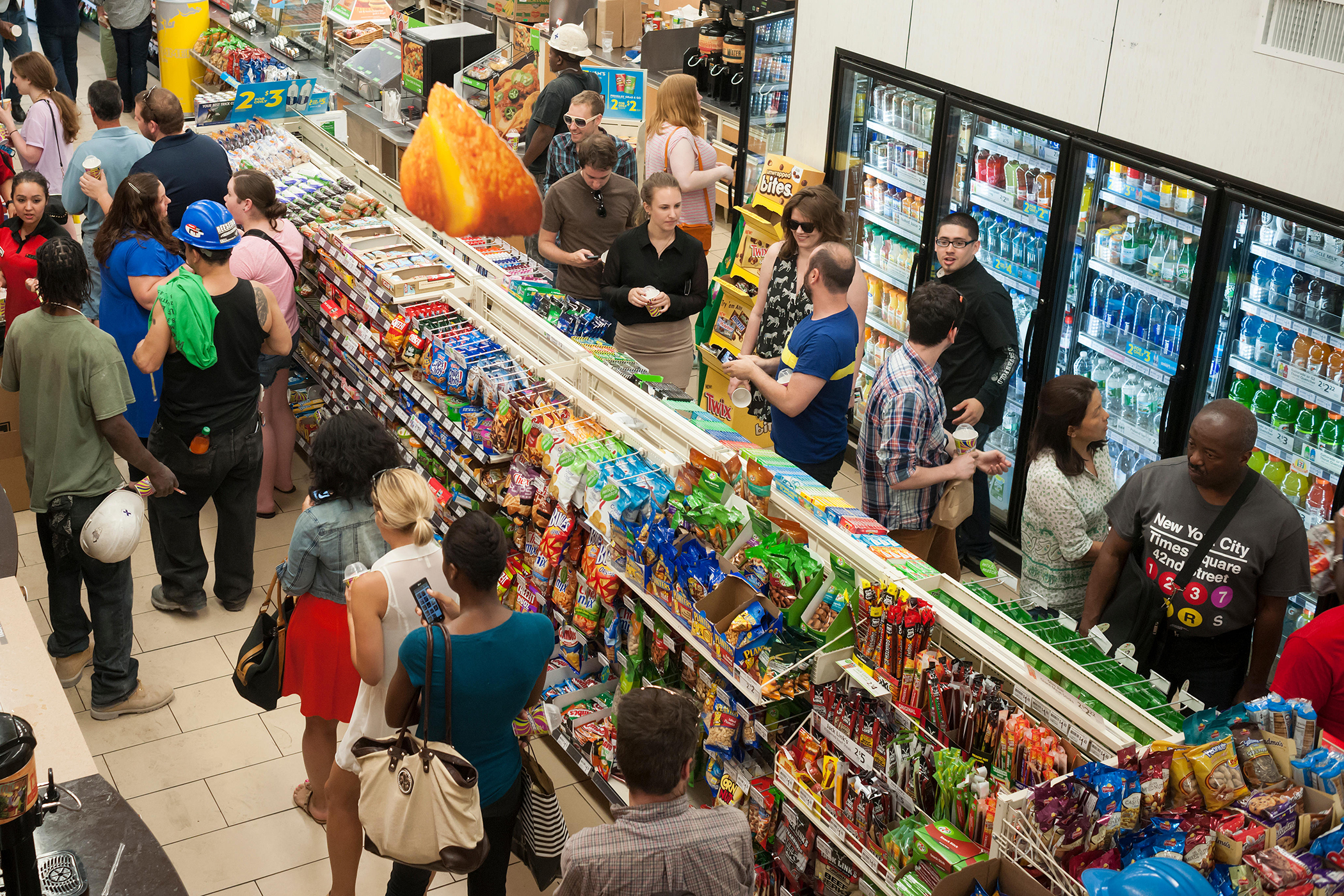 Customers line up for their free Slurpees in a 7-Eleven store in New York