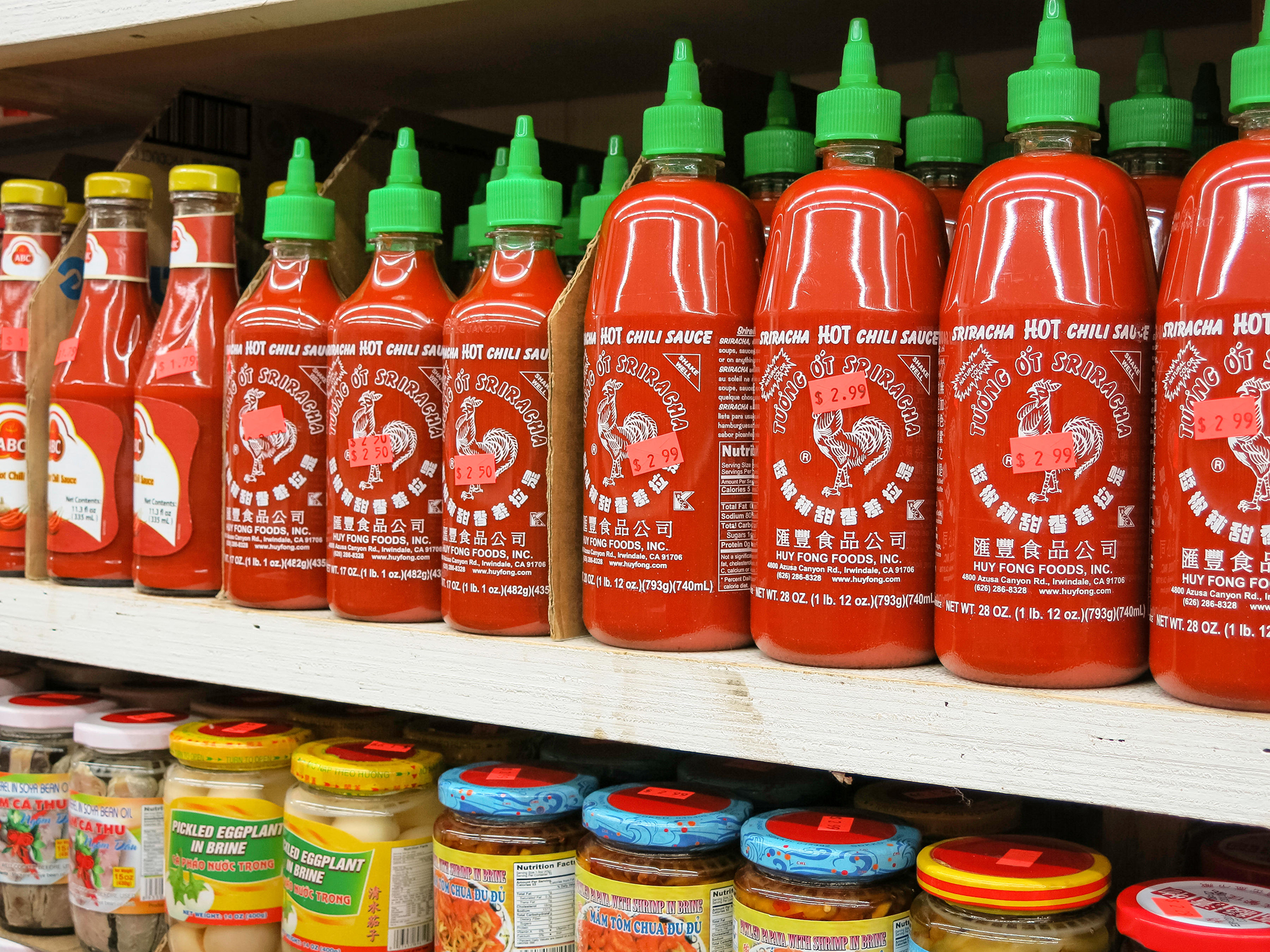 Sriracha bottles on shelf