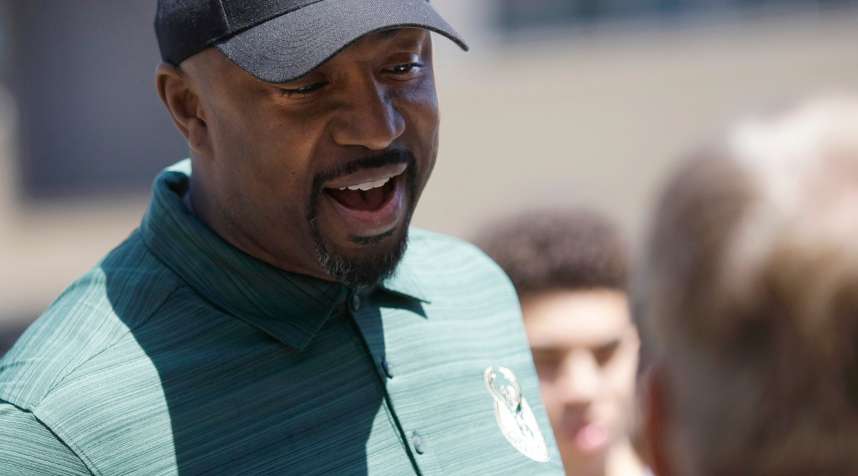 Former Milwaukee Bucks player Vin Baker talks to fans at a summer block party Saturday, June 6, 2015, in Milwaukee. (AP Photo/Aaron Gash)