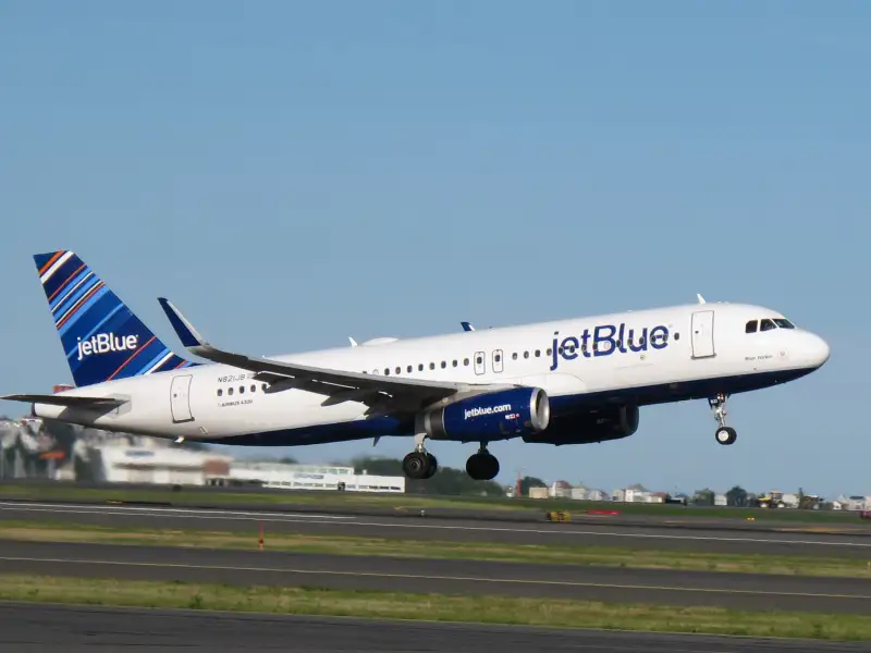 JetBlue plane taking off from runway