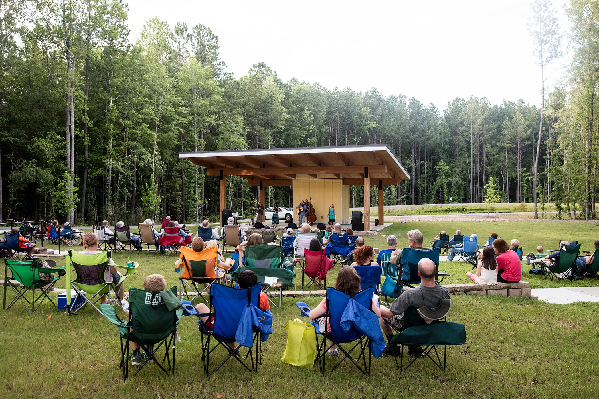 A crowd takes in a free concert by the Swift Creek Band at the Nature Park Amphitheater in Apex, NC