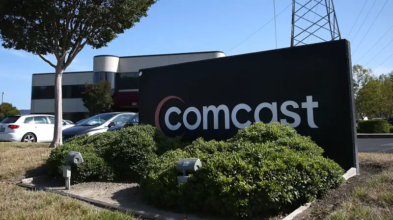 A sign is posted in front of a Comcast service center on July 13, 2015 in San Rafael, California.