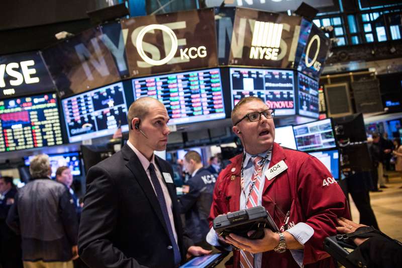 Traders work on the floor of the New York Stock Exchange during the afternoon of August 20, 2015 in New York City. The Dow Jones continued its plunge south, losing over 350 points today.