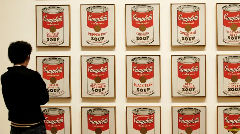 Visitor looking at Campbell´s Soup cans by Andy Warhol, Museum of Modern Art, New York City