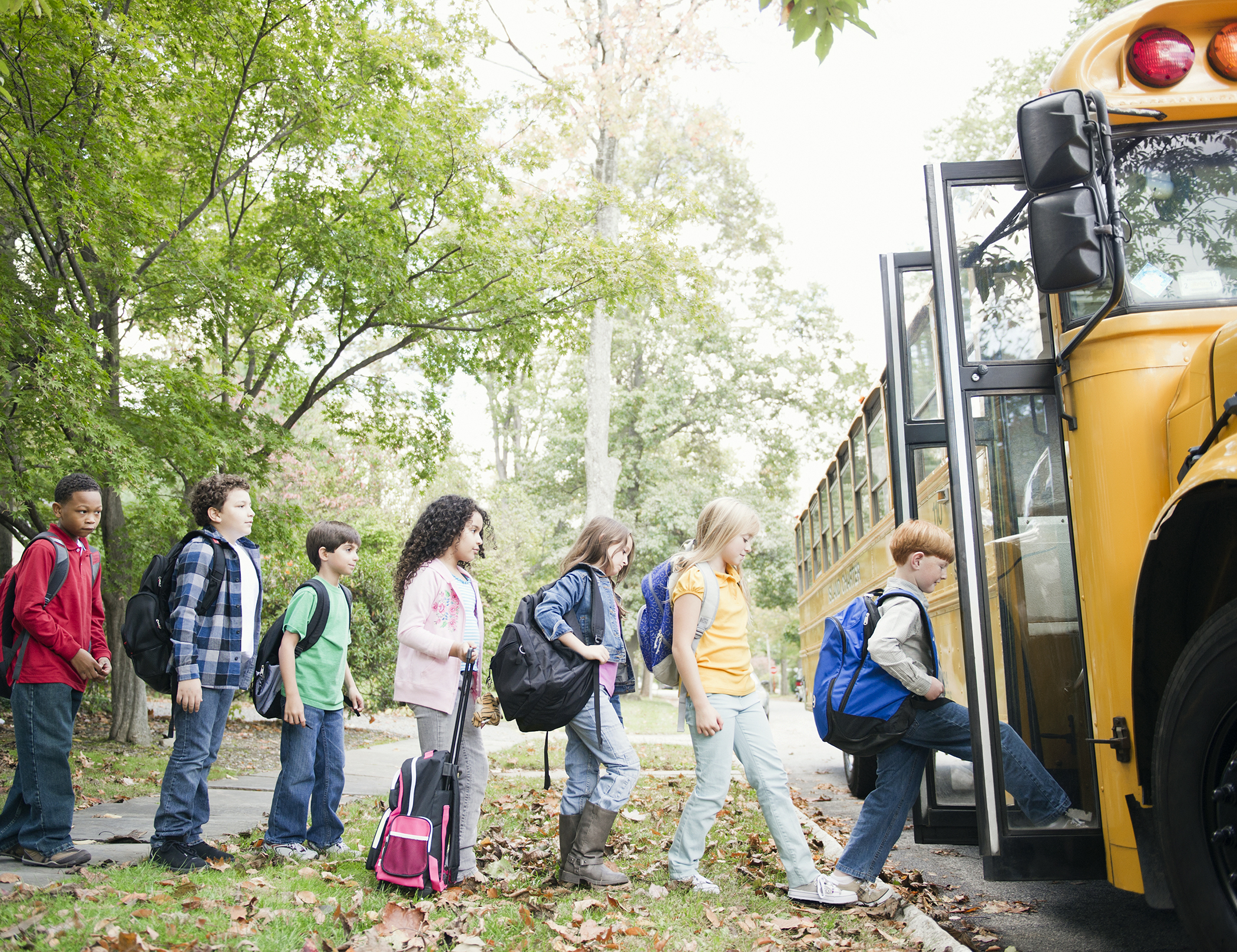 children boarding school bus