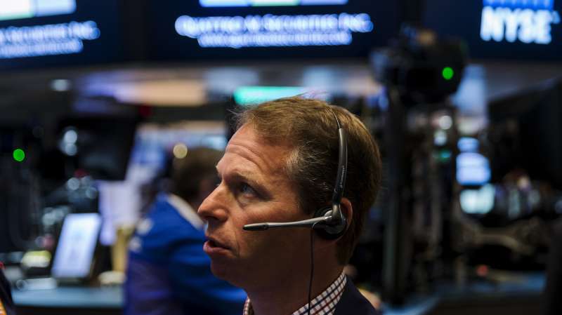 A trader works on the floor of the New York Stock Exchange shortly after the opening bell in New York August 27, 2015.