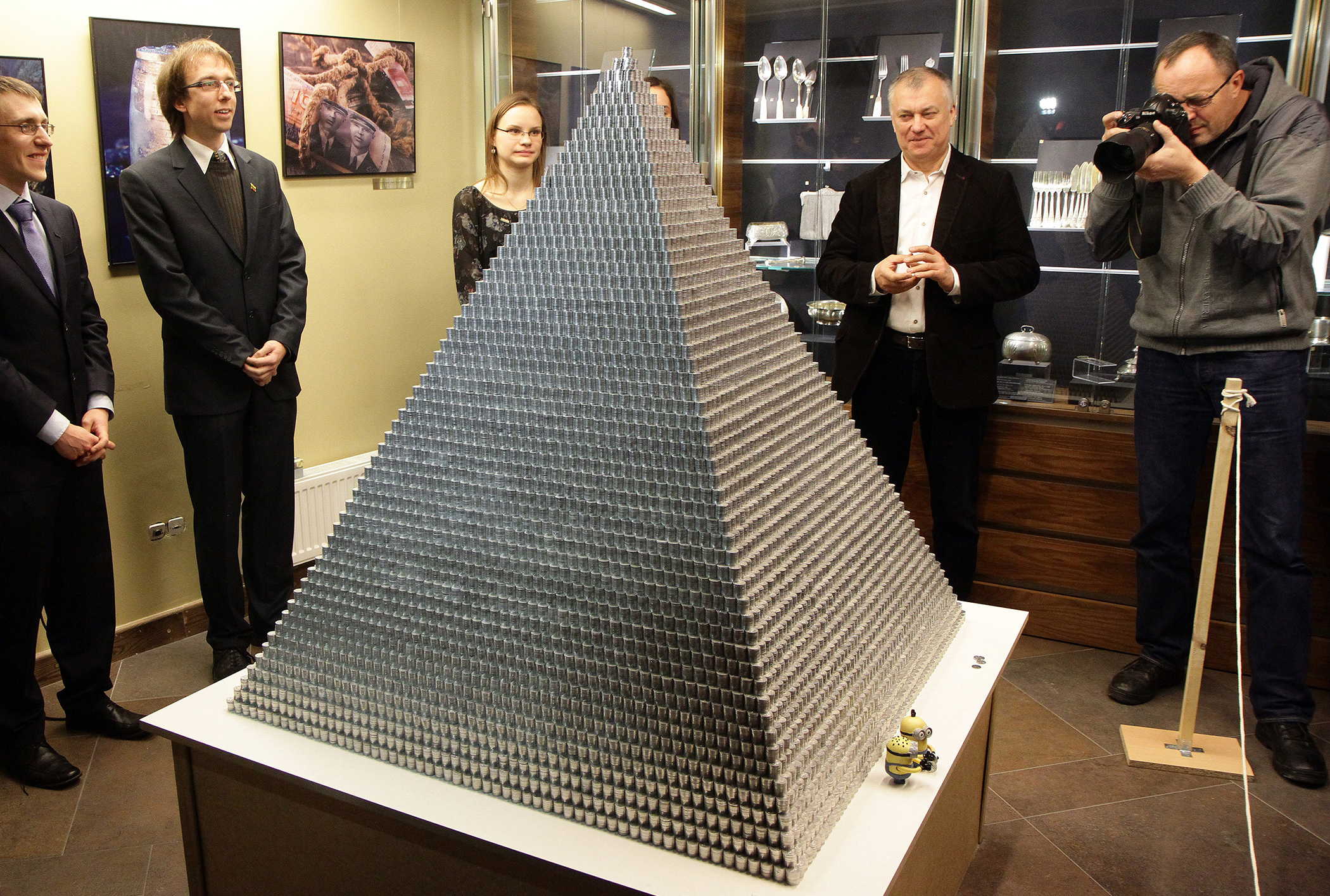 People stand around a pyramid made of 1,000,935 Lithuanian cents on November 29, 2014 in Vilnius, Lithuania.