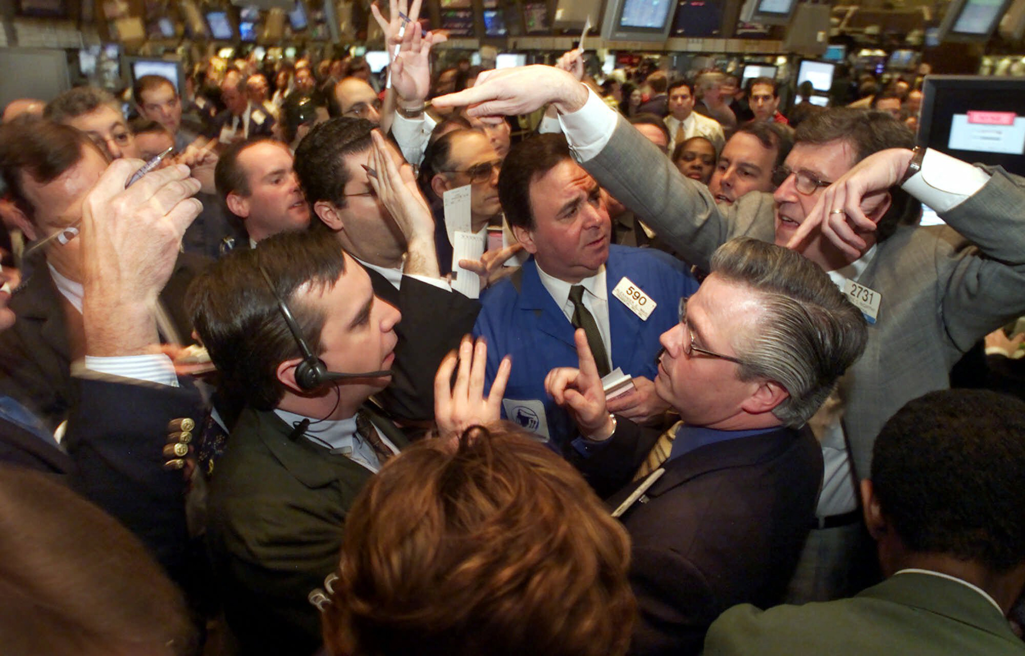 Specialist Eugene McCarthy, right, trades shares of Lucent Technologies on the floor of the New York Stock Exchange, Wednesday morning, April 4, 2001.