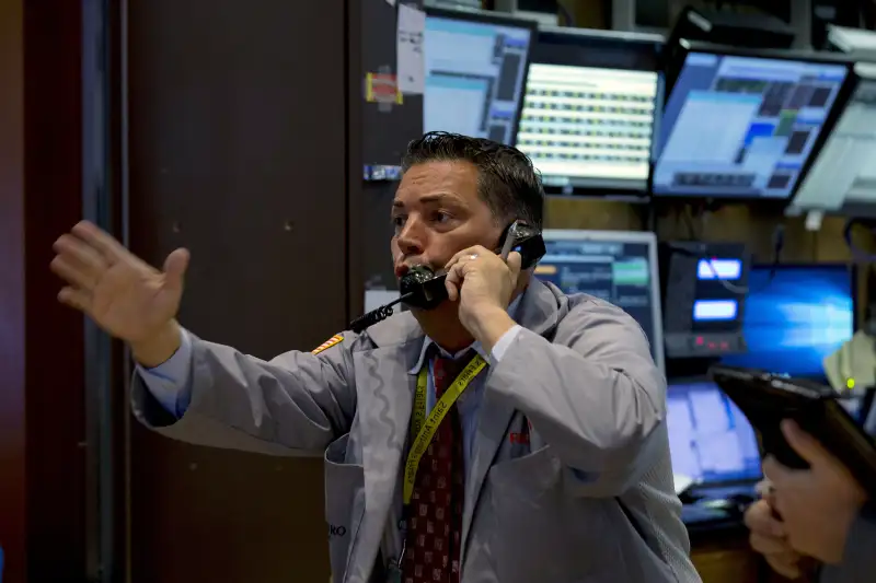 Traders work on the floor of the New York Stock Exchange in New York, September 2, 2015.