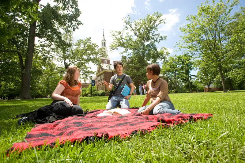 Students Jessica Puckett-Davis, Ahmad Shuja, and Keosha Morgan study outside of Draper on a nice Spring day, Berea College, May 22, 2009.