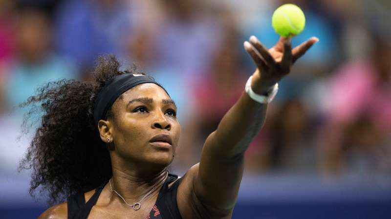 Serena Williams serves to her sister and compatriot Venus Williams during their quarterfinals match at the U.S. Open Championships tennis tournament in New York, September 8, 2015.