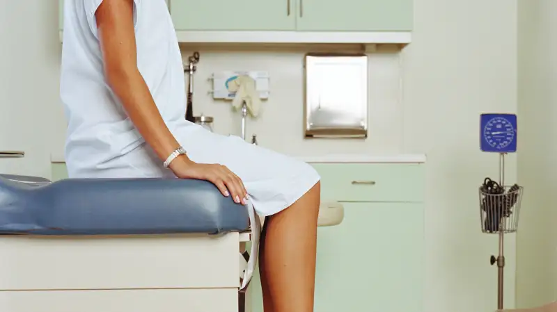 young adult on medical exam table