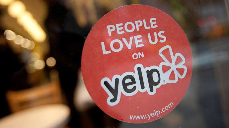 A Yelp sticker in the window of a restaurant in New York on Thursday, March 1, 2012