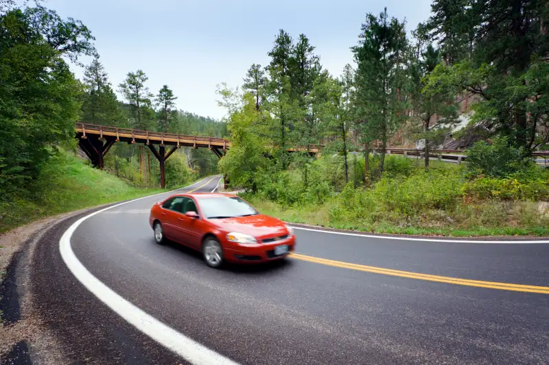 red car on highway