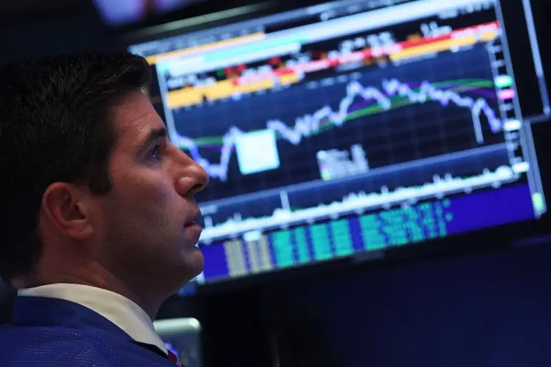 Traders work on the floor of the New York Stock Exchange on September 1, 2015 in New York City. The Dow was down over 450 points at the close.