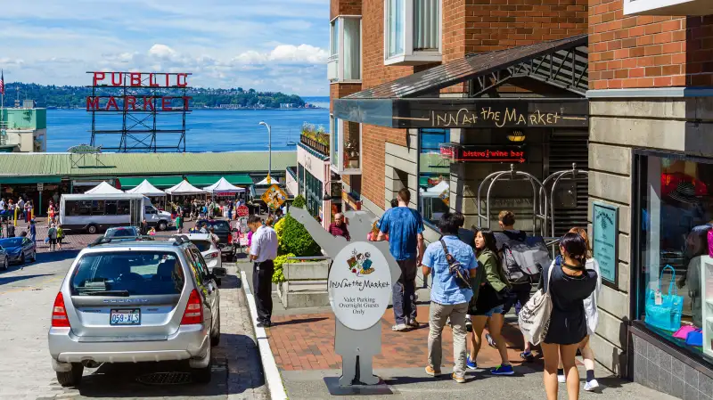 View down Pine Street of Pike Place Market with Inn at the Market in foreground, Seattle