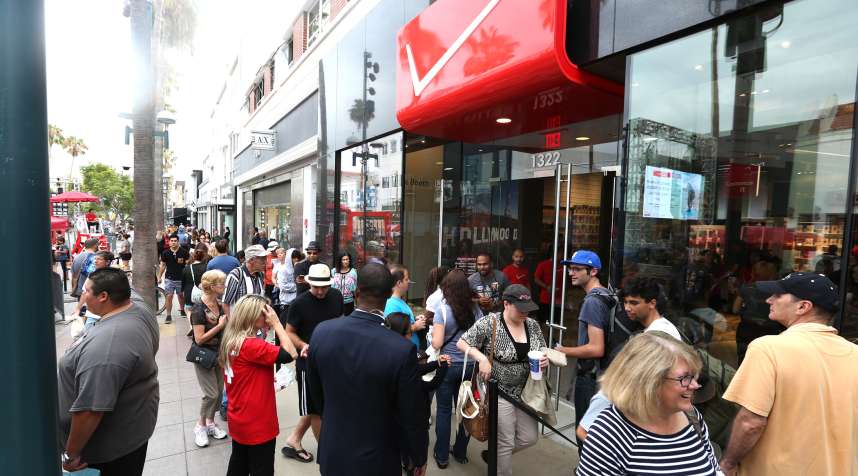 Guests gather outside of the new Verizon Wireless Destination Store to celebrate the Grand Opening on the 3rd Street Promenade in Santa Monica, CA on July 18, 2015.