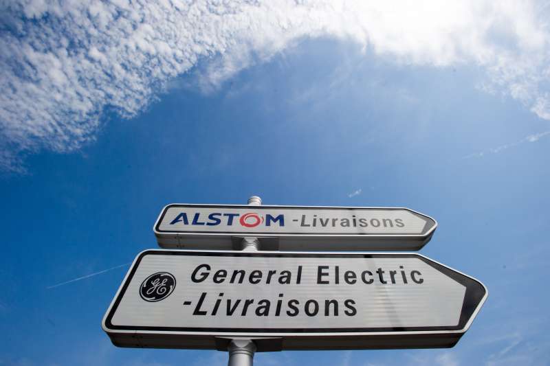 A photo taken on June 23, 2014 in Belfort shows road signs indicating directions for deliveries to French power and transport engineering company Alstom and US conglomerate General Electric (GE).