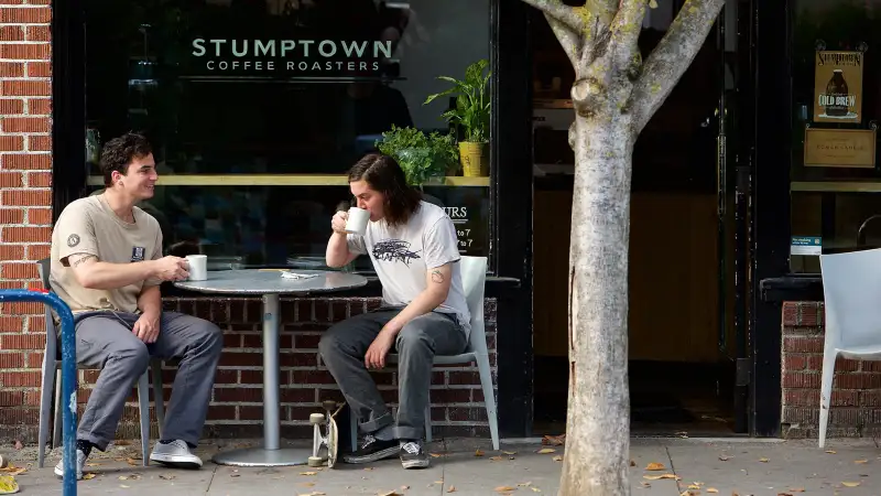 Danny and Donny Johnson of Portland, Oregon drink coffee outside of Stumptown Coffee Roasters on October 6, 2015 in Portland, Oregon.