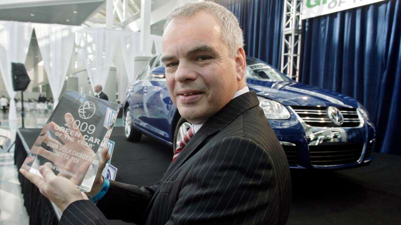 Stefan Jacoby, president and CEO Volkswagen of America, holds the 2009 Green Car of the Year award in front of the 2009 Jetta TDI at the Los Angeles Auto Show, November 20, 2008, in Los Angeles. Green Car Journal named the Jetta TDI as the  Green Car of the Year,  making it the first clean-diesel car to win the award.