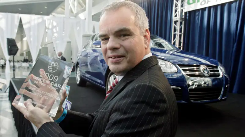 Stefan Jacoby, president and CEO Volkswagen of America, holds the 2009 Green Car of the Year award in front of the 2009 Jetta TDI at the Los Angeles Auto Show, November 20, 2008, in Los Angeles. Green Car Journal named the Jetta TDI as the Green Car of the Year, making it the first clean-diesel car to win the award.
