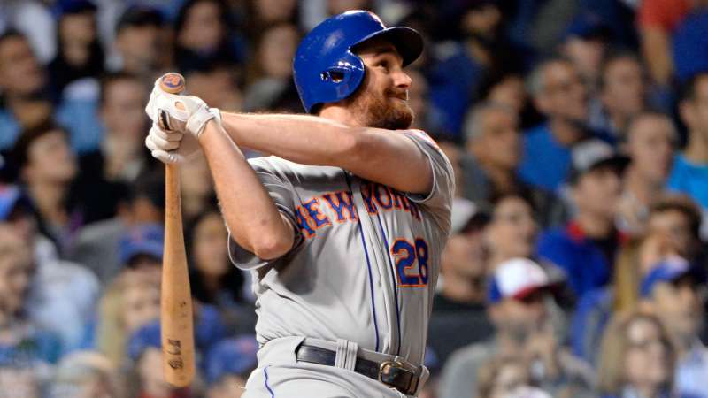 Daniel Murphy #28 of the New York Mets hits a two-run home run in the top of the eighth inning of Game 4 of the NLCS against the Chicago Cubs at Wrigley Field on Wednesday, October 21, 2015 in Chicago, Illinois.