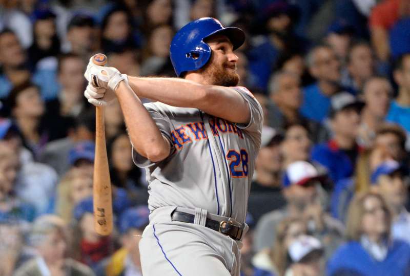 Daniel Murphy #28 of the New York Mets hits a two-run home run in the top of the eighth inning of Game 4 of the NLCS against the Chicago Cubs at Wrigley Field on Wednesday, October 21, 2015 in Chicago, Illinois.