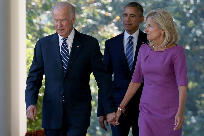 Vice President Joe Biden, followed by U.S. President Barack Obama, holds hands with his wife Jill Biden while walking to the Rose Garden to announce that he will not seek the presidency.