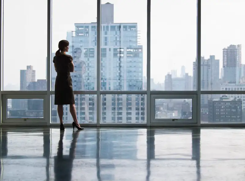 Business woman looking out window