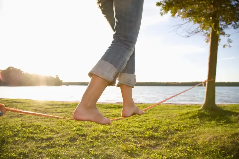 Woman balancing on slackline